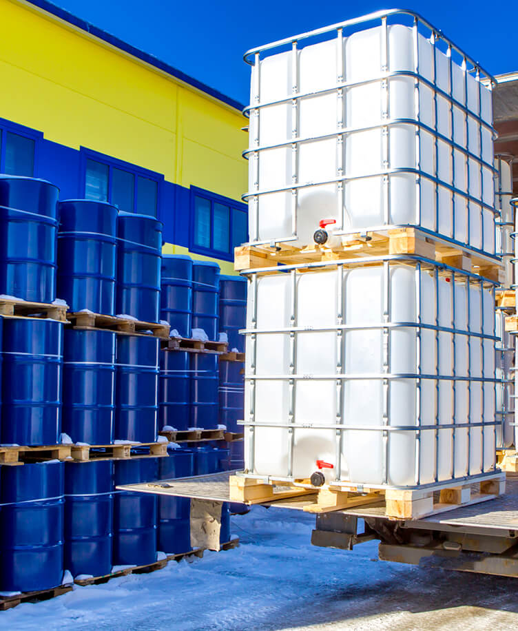 Image of chemical containers on a forklift.